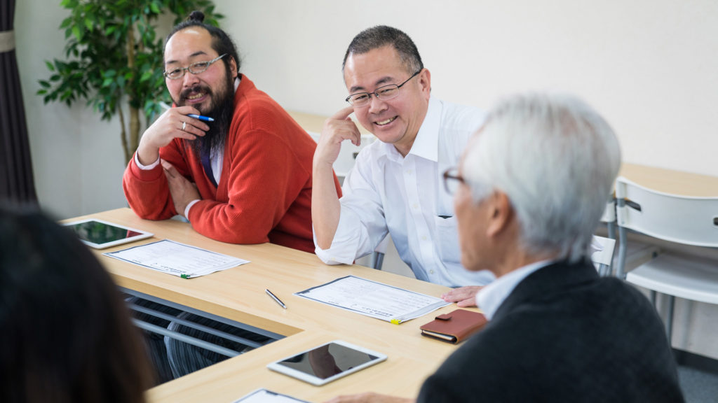 Older 3 men at table